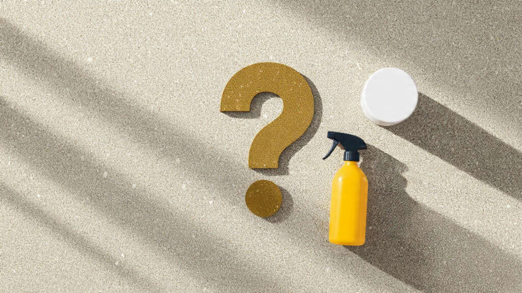 Question mark sign with DIY carpet cleaner spray bottle on clean carpet.