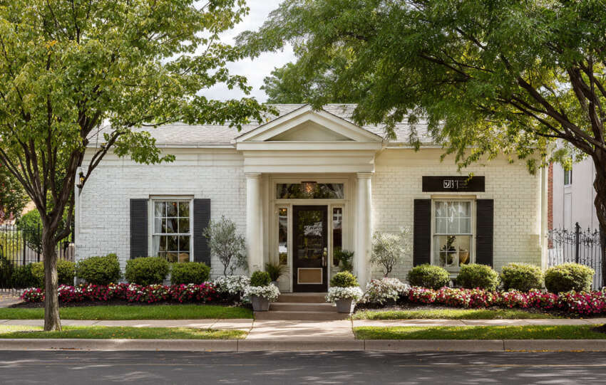 Interior setup of Lindley Funeral Home for a funeral service with flowers and seating.
