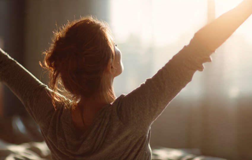 Person experiencing relief from chronic pain in a calm home environment